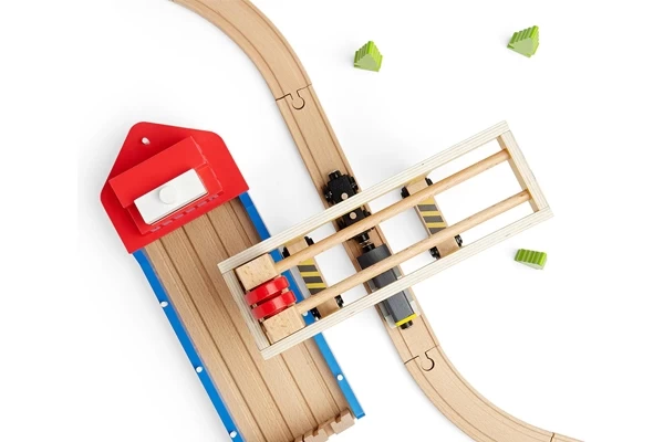 Over houten treinrail te plaatsen